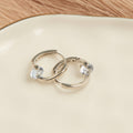 Dazzler Twisted Cubic Zirconia Hoop Earrings